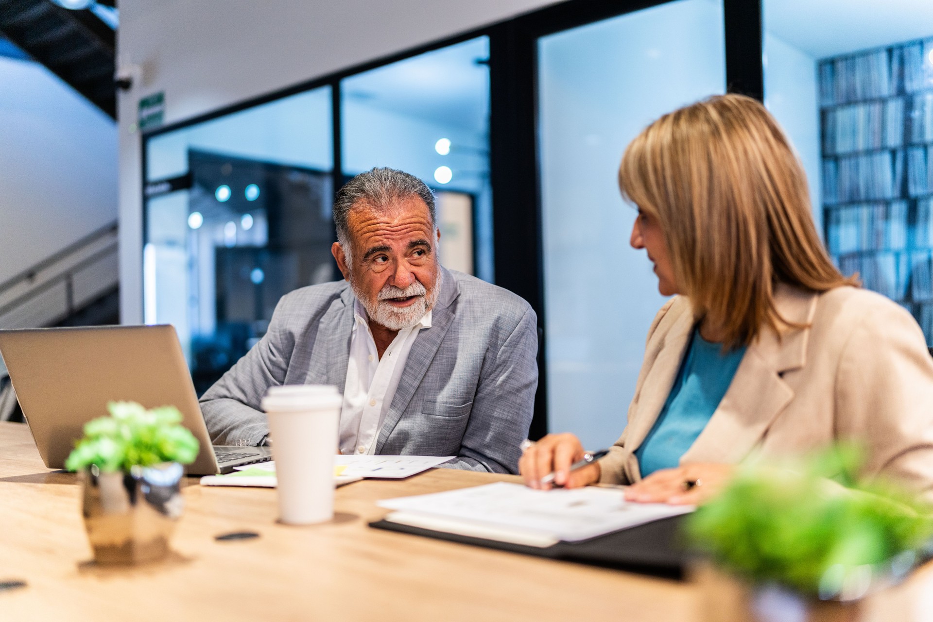 Coworkers talking at office